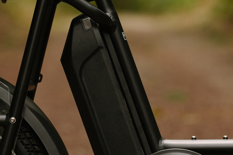 A black Safe Shield battery on a matte black electric bike