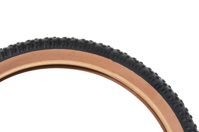 Ebike tire with tan sidewall, branded with "Kenda" in the sidewall