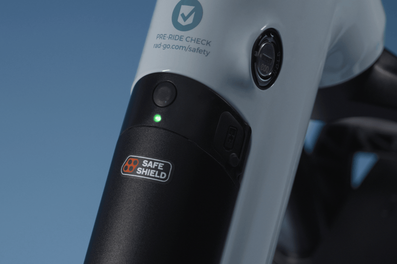 An illuminated battery on a RadKick bike