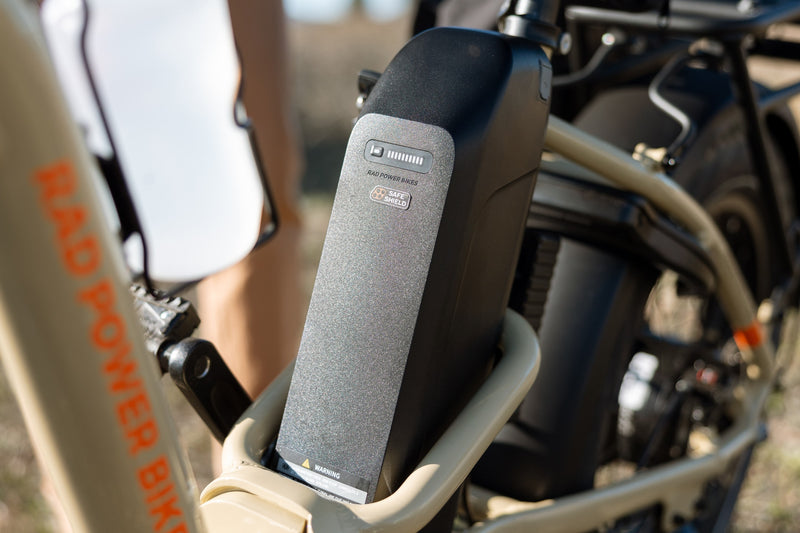 Safe Shield Advanced External Battery installed on a Store Tan RadExpand 5 Plus electric folding bike